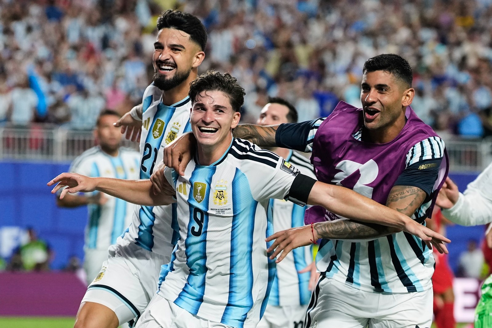 Julian Alvarez celebrates with his Argentina teammates against Switzerland. Source: AP.