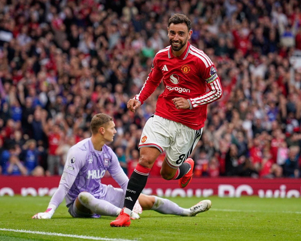 Bruno Fernandes turns away to celebrate after scoring his side's fourth goal to complete his hat-trick against Ipswich (30 Aug 2026). Source: The Guardian.