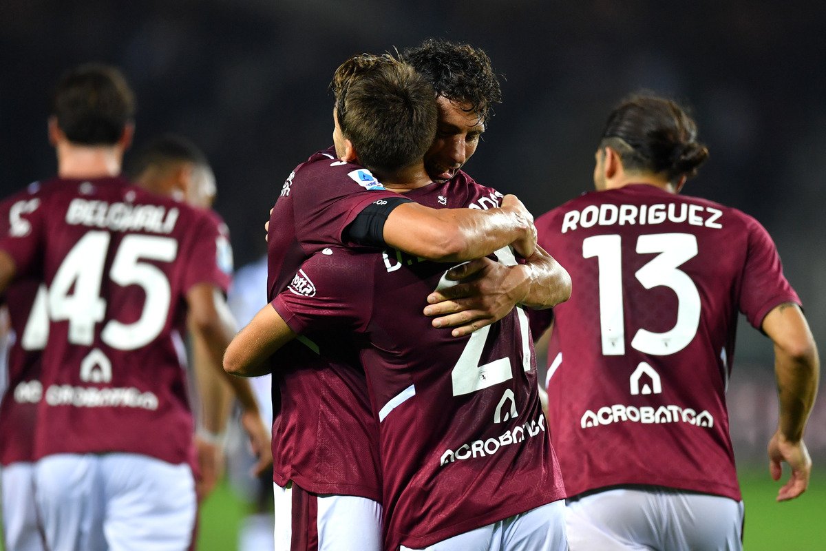 Torino players embrace in celebration in a recent match, with the No. 13 shirt of Rodriguez on the right, press photo of 12 Oct 2026. Source: Football Italia.